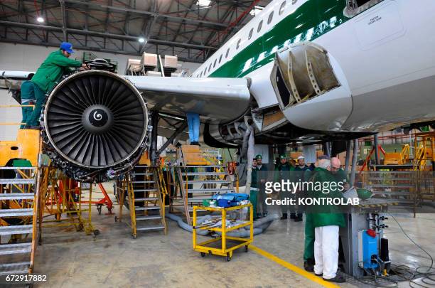 Atitech workers, work on a motor of one Alitalia airplane in Atitech Factory, in the airport of Capodichino in Naples.