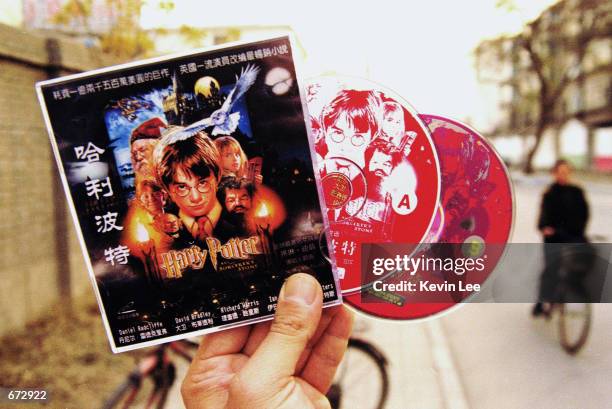 Pirated copy of the movie "Harry Potter and the Sorcerer's Stone," which were purchased in a shop of Beijing, on are display November 22, 2001 in...