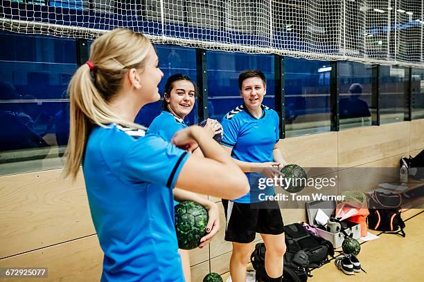 young female handball players at training session - handbal stockfoto's en -beelden