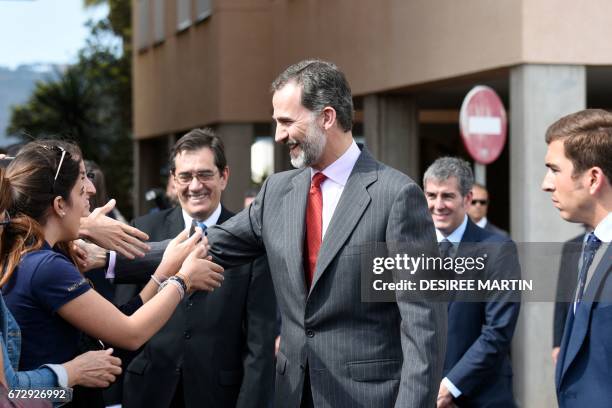 Spain's King Felipe VI greets students of the University of La Laguna during the visit of the laboratories of the University Institute of Tropical...