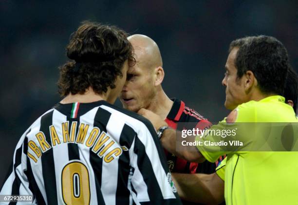 October 2005. Ibrahimovic of Juventus and Jaap Stam of Milan compete for the ball during the 10th Serie A round league match played between Milan and...