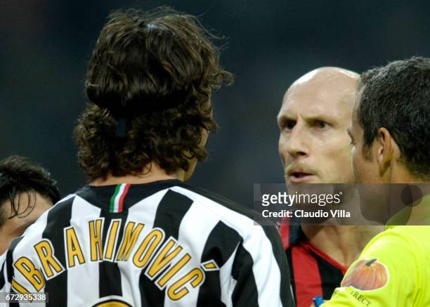 October 2005. Ibrahimovic of Juventus and Jaap Stam of Milan compete for the ball during the 10th Serie A round league match played between Milan and...