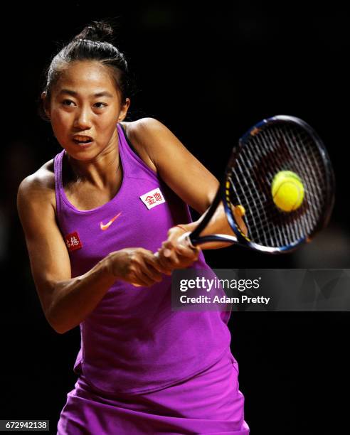 Zhang Shuai of China plays a backhand in her match against Laura Siegemund of Germany during the Porsche Tennis Grand Prix at Porsche Arena on April...