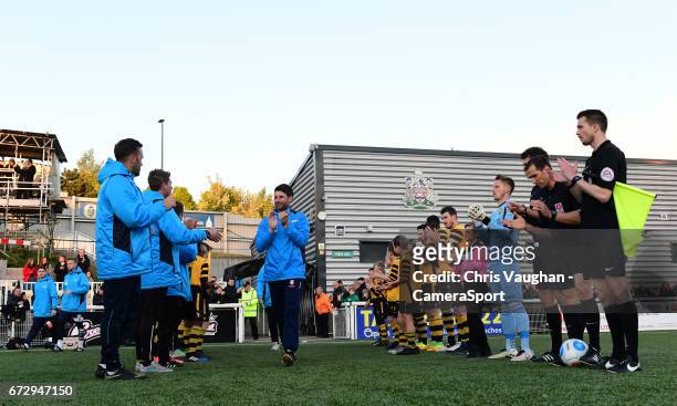 Lincoln City manager Danny Cowley walks through a guard of honour formed by the Maidstone United players prior to the Vanarama National League match...