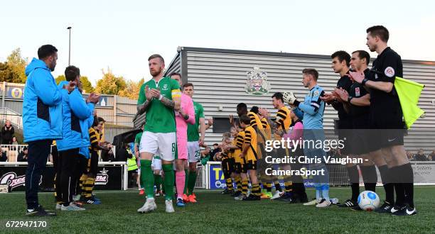 Lincoln City players, led out by Lincoln City's Alan Power walk through a guard of honour formed by the Maidstone United players prior to the...