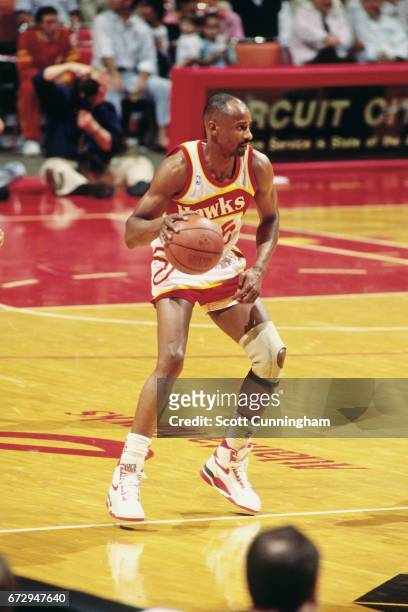 Sidney Moncrief of the Atlanta Hawks dribbles during a game played circa 1990 at the Omni in Atlanta, Georgia. NOTE TO USER: User expressly...