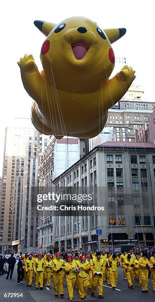 The Pikachu balloon floats down Broadway during the 75th annual Macy's Thanksgiving Day parade November 22, 2001 in New York City.