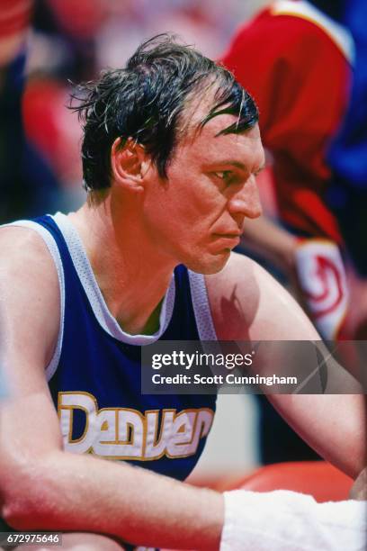 Dan Issel of the Denver Nuggets sits on the bench against the Atlanta Hawks during a game played circa 1990 at the Omni in Atlanta, Georgia. NOTE TO...