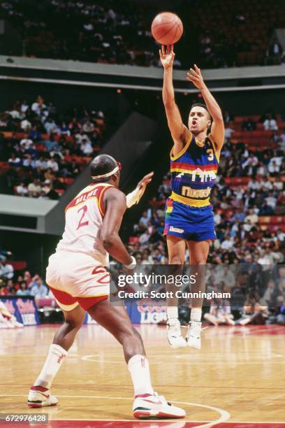 Chris Jackson of the Denver Nuggets shoots against the Atlanta Hawks during a game played circa 1990 at the Omni in Atlanta, Georgia. NOTE TO USER:...