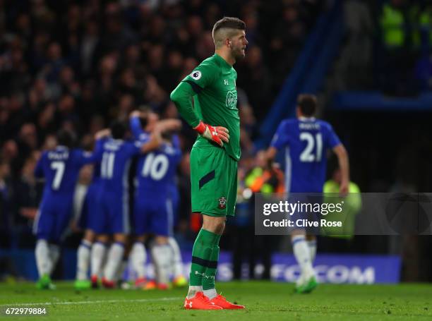 Fraser Forster of Southampton reacts as Diego Costa of Chelsea scores their fourth goal during the Premier League match between Chelsea and...