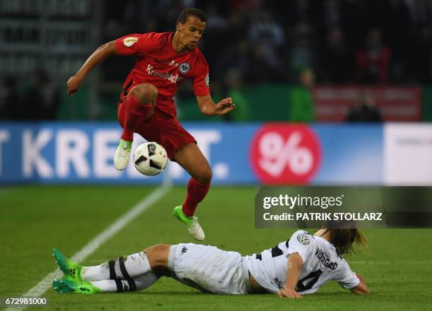 Frankfurt's US defender Timothy Chandler and Moenchengladbach's midfielder Marvin Schulz vie for the ball during the German Cup DFB Pokal semifinal...