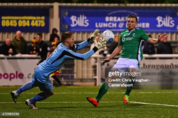 Maidstone United's Lee Worgan saves under pressure from Lincoln City's Jack Muldoon during the Vanarama National League match between Maidstone...