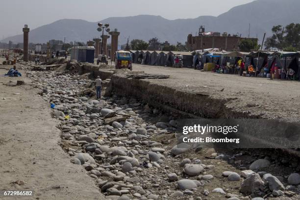 Displaced residents are seen at a temporary housing camp near the destroyed village of Carapongo, Chosica district in Lima, Peru, on Saturday, April...