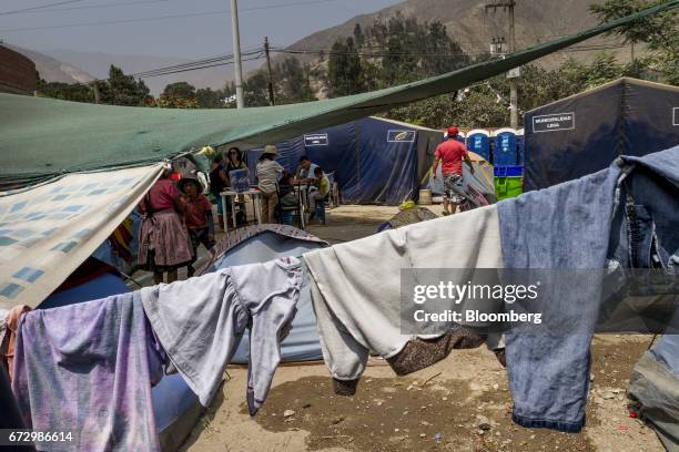 Laundry hangs between tents at a temporary housing camp near the town of La Cantutua, Chosica district in Lima, Peru, on Saturday, April 22, 2017....