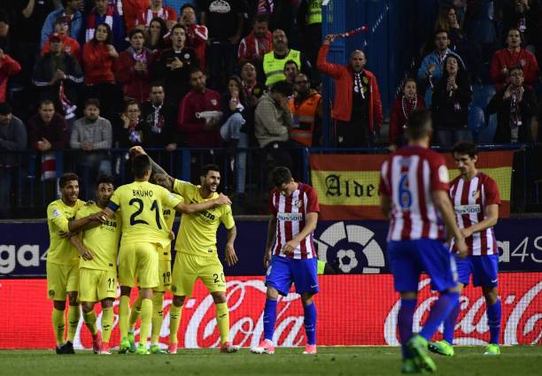 Villarreal's players celebrate after Villarreal's Italian midfielder Roberto Soriano scored during the Spanish league football match Club Atletico de...