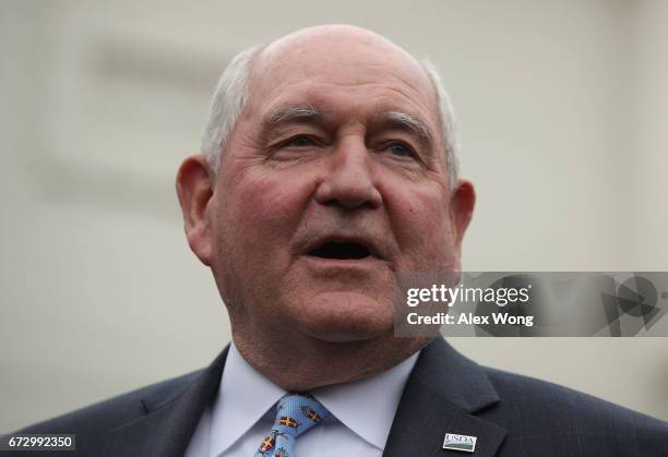 Agriculture Secretary Sonny Perdue speaks to members of the media outside the West Wing of the White House after a Roosevelt Room event April 25,...