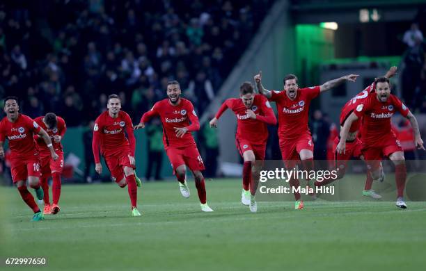The team of Frankfurt celebrate during penalty shoot out during the DFB Cup semi final match between Borussia Moenchengladbach and Eintracht...