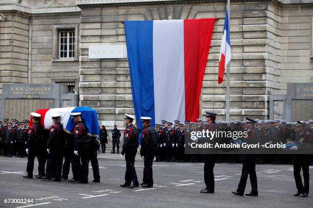 The coffin arrives at the National tribute to fallen French Policeman Xavier Jugele on April 25, 2017 in Paris, France. French Police Officer Xavier...