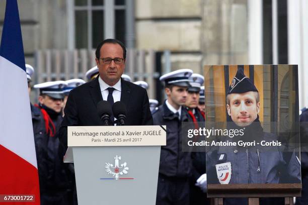 French President Francois Hollande addresses Police officers during the National tribute to fallen French Policeman Xavier Jugele on April 25, 2017...