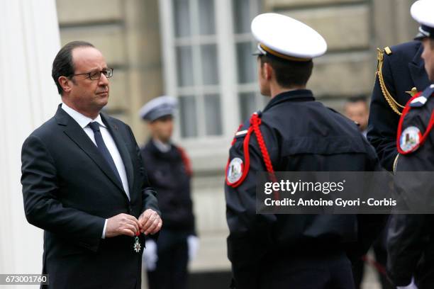 French President Francois Hollande addresses Police officers during the National tribute to fallen French Policeman Xavier Jugele on April 25, 2017...