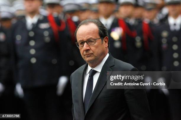 French President Francois Hollande attends the National tribute to fallen French Policeman Xavier Jugele on April 25, 2017 in Paris, France. French...