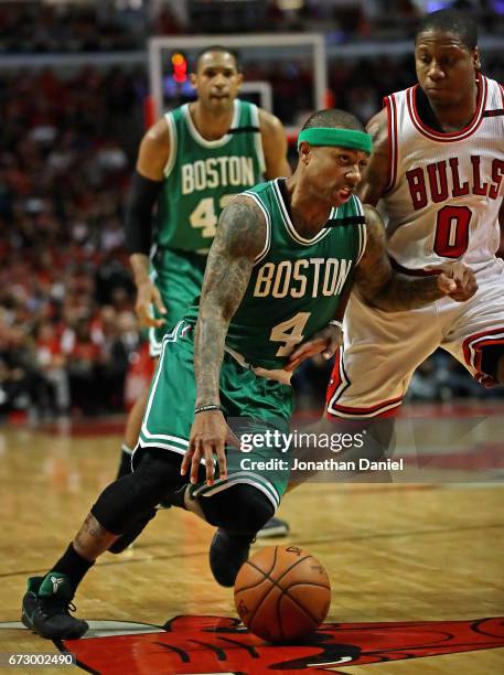 Isaiah Thomas of the Boston Celtics drives around Isaiah Canaan of the Chicago Bulls during Game Four of the Eastern Conference Quarterfinals during...