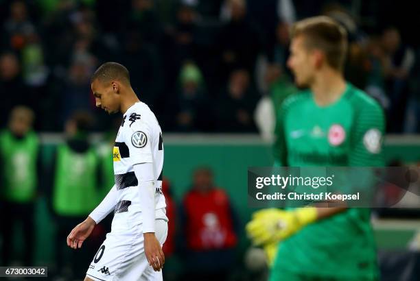 Djibril Sow of Moenchengladbach looks dejected during penalty shoot out during the DFB Cup semi final match between Borussia Moenchengladbach and...