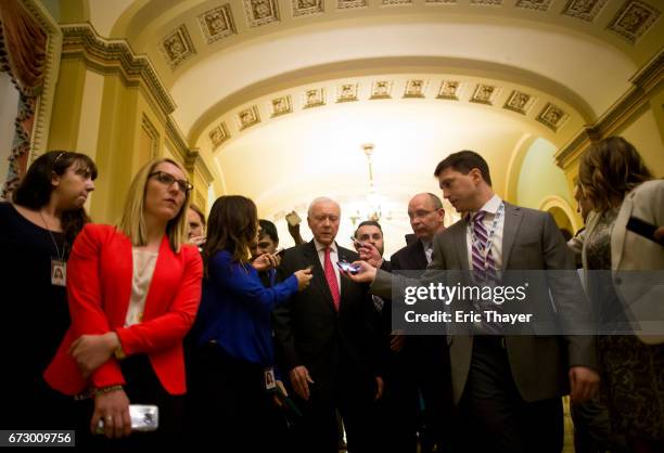 Senate Finance Committee Chairman Orrin Hatch leaves a closed meeting between Congressional leaders and representatives of the White House to discuss...