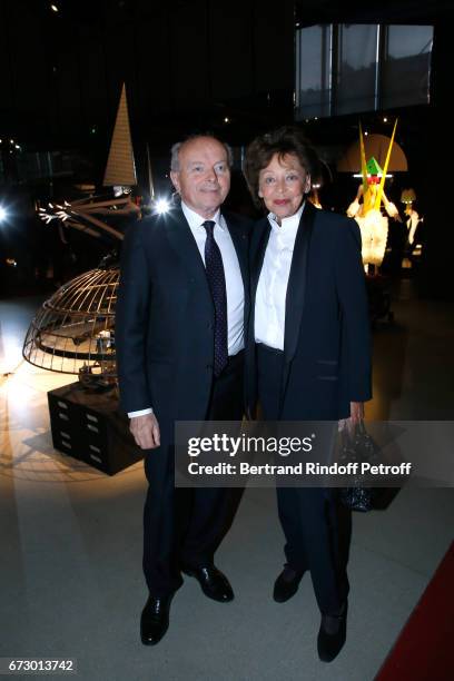 Jacques Toubon and his wife Lise pose in front the works of Jean-Paul Goude during the "Societe des Amis du Musee d'Art Moderne du Centre Pompidou" :...