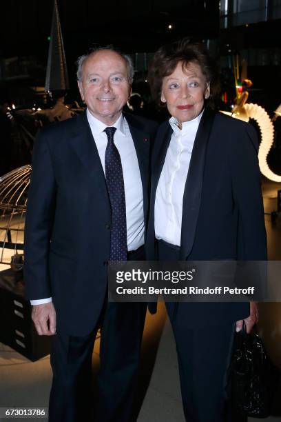Jacques Toubon and his wife Lise pose in front the works of Jean-Paul Goude during the "Societe des Amis du Musee d'Art Moderne du Centre Pompidou" :...