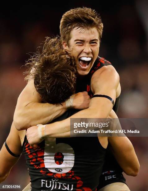 Joe Daniher of the Bombers celebrates a goal with Zach Merrett of the Bombers during the 2017 AFL round 05 ANZAC Day match between the Essendon...