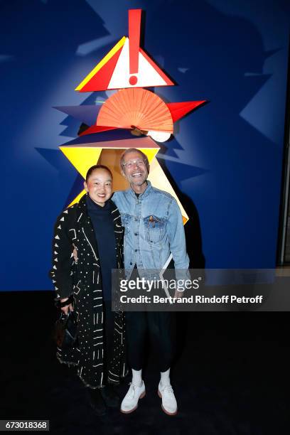 Jean-Paul Goude and his wife Karen pose in front the works of Jean-Paul Goude during the "Societe des Amis du Musee d'Art Moderne du Centre Pompidou"...