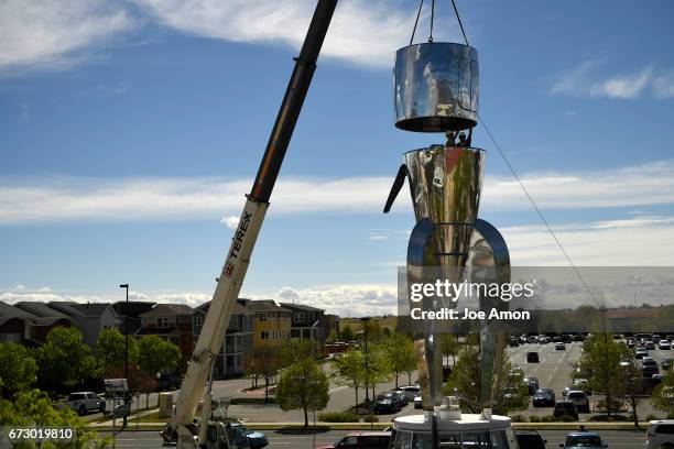 April 25: Artist's Stephanie Shipman and David Shulman guide in main deck to secure it to the Life sciences and Bio lab section of the spacecraft as...