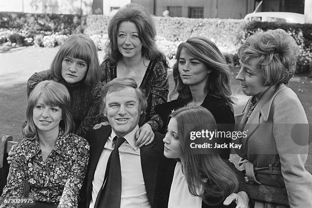 Australian-born actor Keith Michell , who is playing the part of King Henry VIII in the film 'Henry VIII and His Six Wives', with the actresses who...