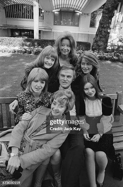 Australian-born actor Keith Michell , who is playing the part of King Henry VIII in the film 'Henry VIII and His Six Wives', with the actresses who...