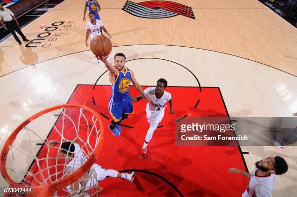 Stephen Curry of the Golden State Warriors goes to the basket against the Portland Trail Blazers during Game Four of the Western Conference...
