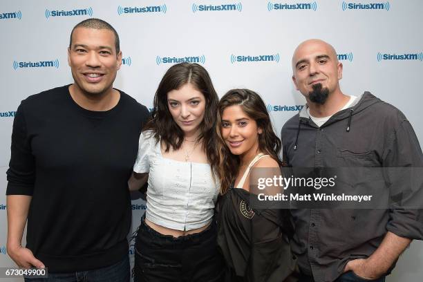 SiriusXM Host Michael Yo, Lorde, SiriusXM Hosts Symon, and SiriusXM Host Tony Fly pose for a photo as Lorde visits ÔHits 1 in HollywoodÕ on SiriusXM...
