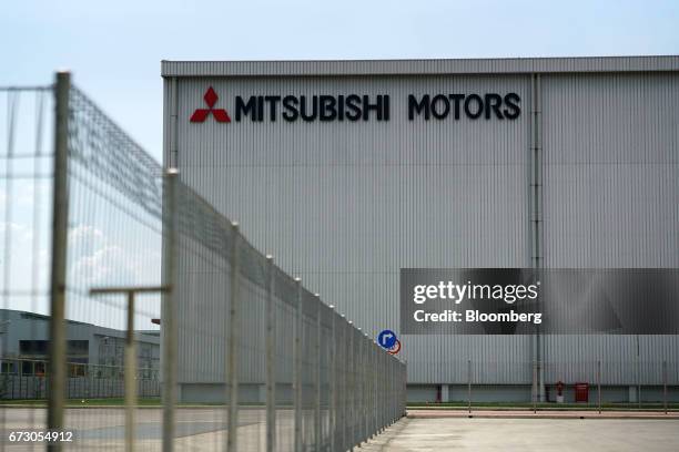 Signage for Mitsubishi Motors Corp. Is displayed outside the company's plant in Cikarang, Indonesia, on Tuesday, April 25, 2017. Mitsubishi Motors...