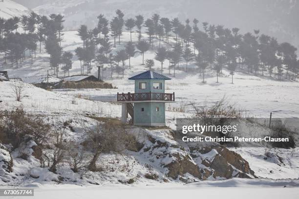 north korean border guard tower in winter - north korea stock pictures, royalty-free photos & images