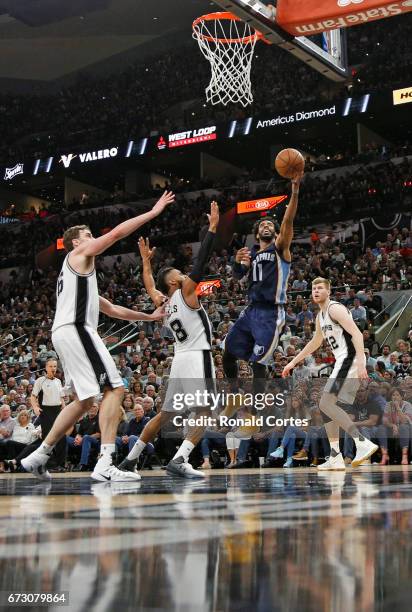 Mike Conley of the Memphis Grizzlies scores against a host of San Antonio Spurs in Game Five of the Western Conference Quarterfinals during the 2017...