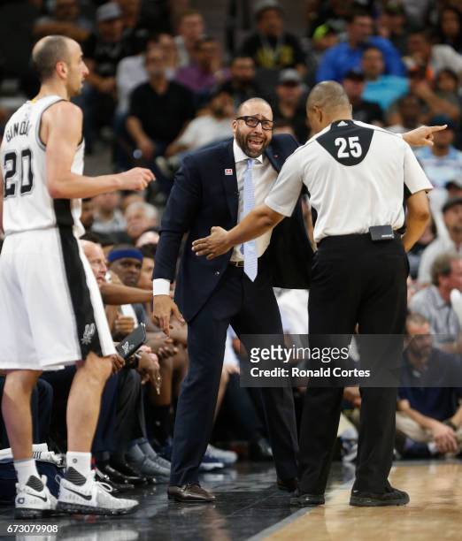 Head coach David Fizdale of the Memphis Grizzlies argues with official Tony Brothers as Manu Ginobili of the San Antonio Spurs awaits to throw the...