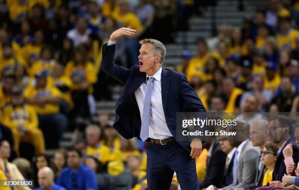 Head coach Steve Kerr of the Golden State Warriors motions to his team during their game against the Portland Trail Blazers in Game Two of the...