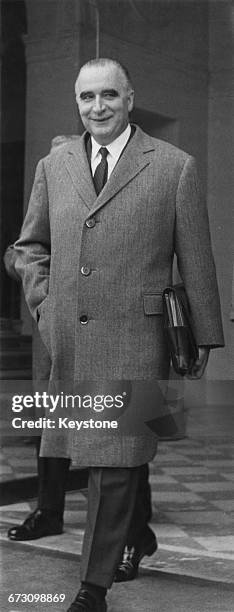 French Prime Minister Georges Pompidou leaves the Élysée Palace in Paris after a cabinet meeting at which the Common Market was the main topic of...