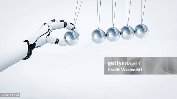 ilustrações, clipart, desenhos animados e ícones de robot's hand pushing newton's cradle, 3d rendering - enfeite de mesa