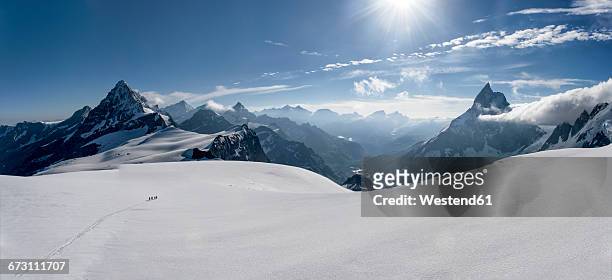 switzerlalnd, mountaineers heading to matterhorn and wandfluehorn - schweizer alpen stock-fotos und bilder