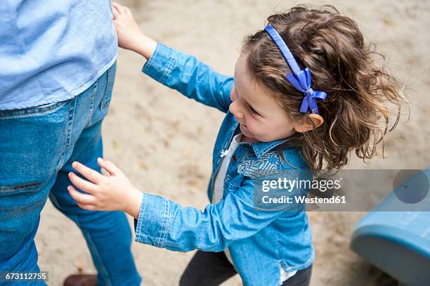 daughter with father on playground - family playing tag stock pictures, royalty-free photos & images