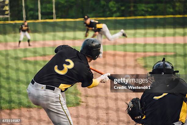 baseball player hitting the ball - baseball game stock pictures, royalty-free photos & images