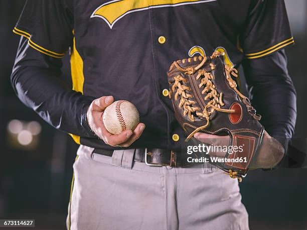 baseball player holding baseball - baseball catcher stock pictures, royalty-free photos & images