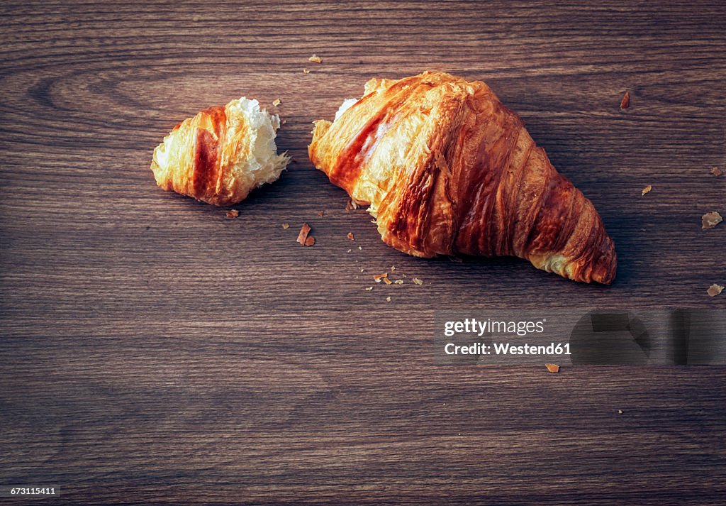 Croissant on dark wood