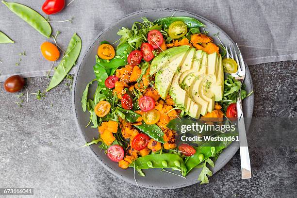 fresh salad with rocket, sweet potato, avocado, tomato, chia seeds, snow pea - サヤエンドウ ストックフォトと画像